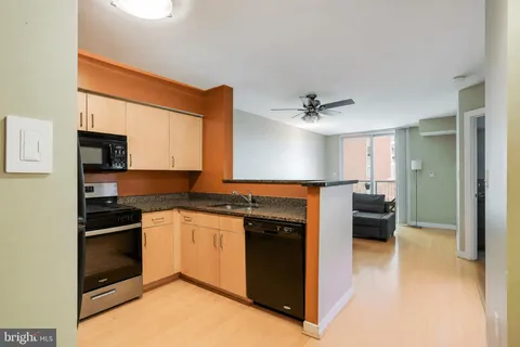 a kitchen with a sink stove and refrigerator