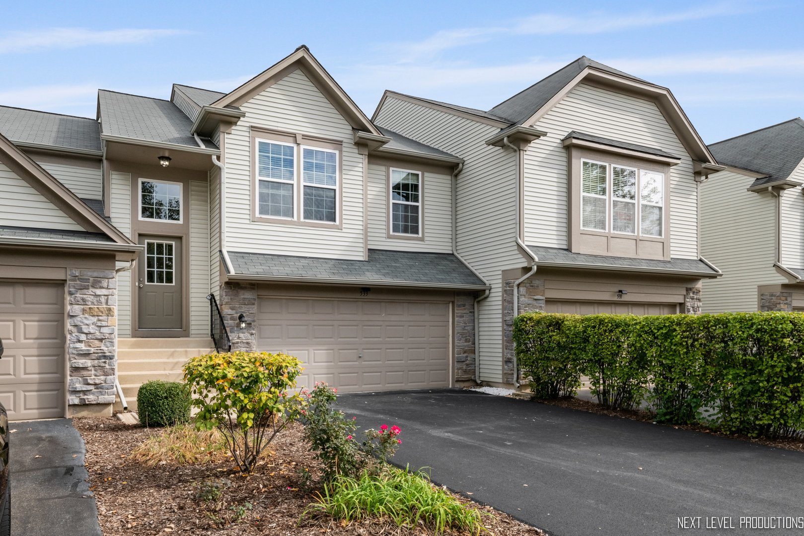 533 Metropolitan Street Aurora, IL 60502 - Photo 18 of 18 a front view of a house with garden