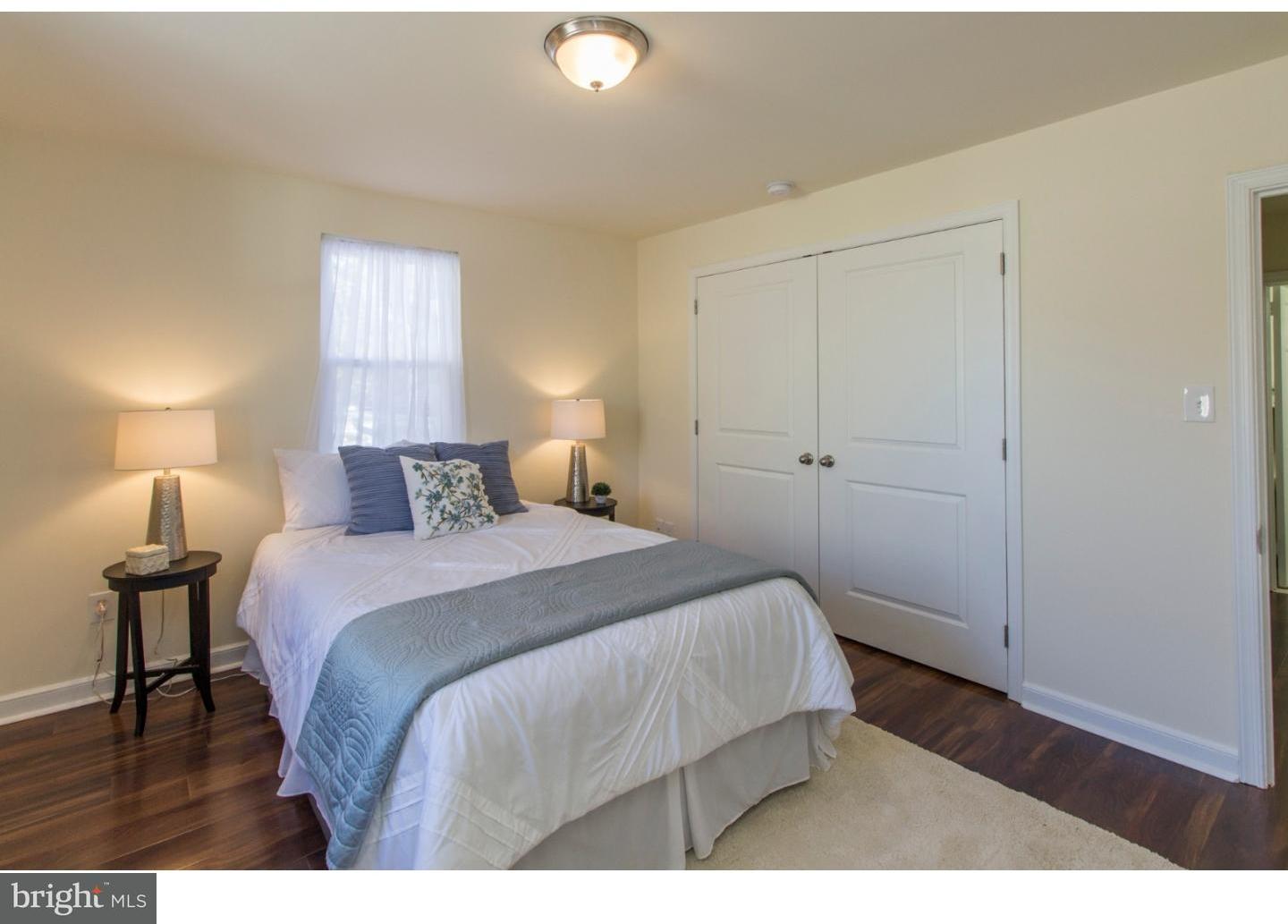 343 Kent Road Springfield, PA 19064 - Photo 14 of 25 a bedroom with a bed and a night stand