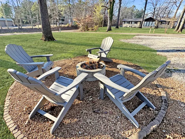a view of a backyard with sitting area