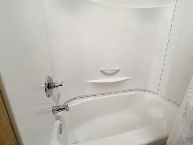 a close view of a bathtub in bathroom