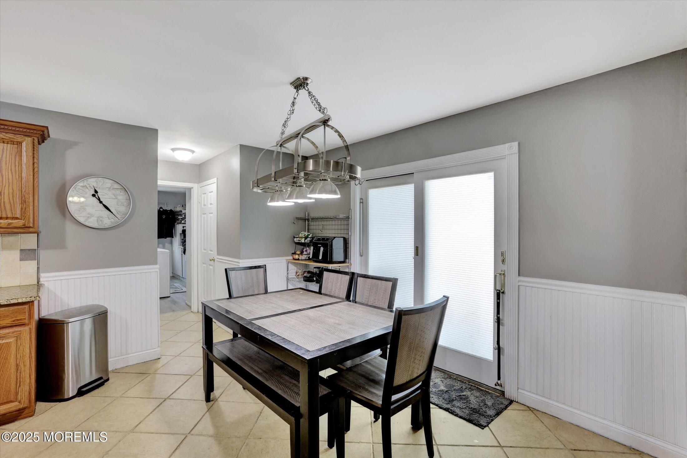 8 Shadow Ridge Court Howell, NJ 07731 - Photo 12 of 39 a view of a dining room with furniture and chandelier