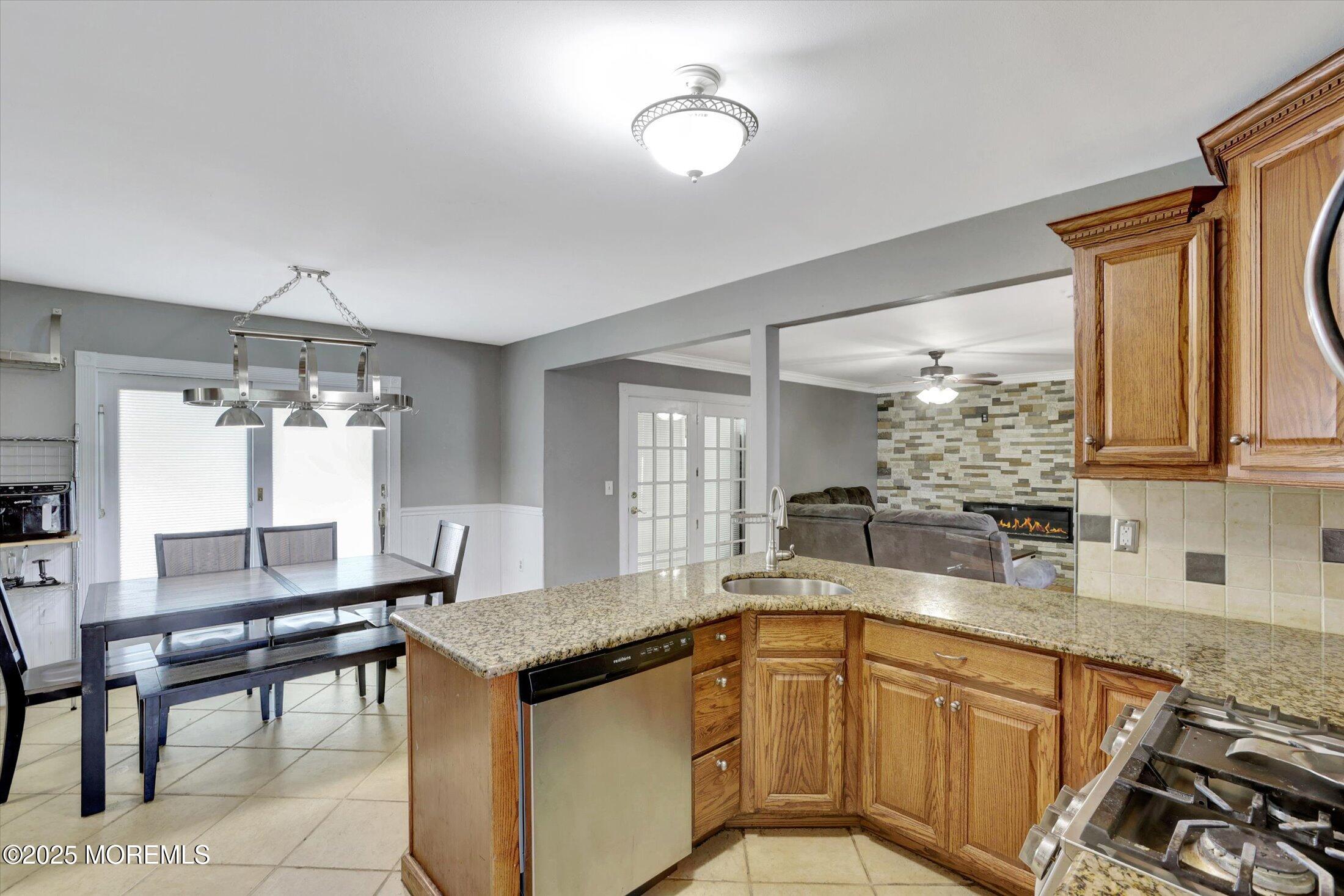 8 Shadow Ridge Court Howell, NJ 07731 - Photo 14 of 39 a kitchen with granite countertop a sink and a stove