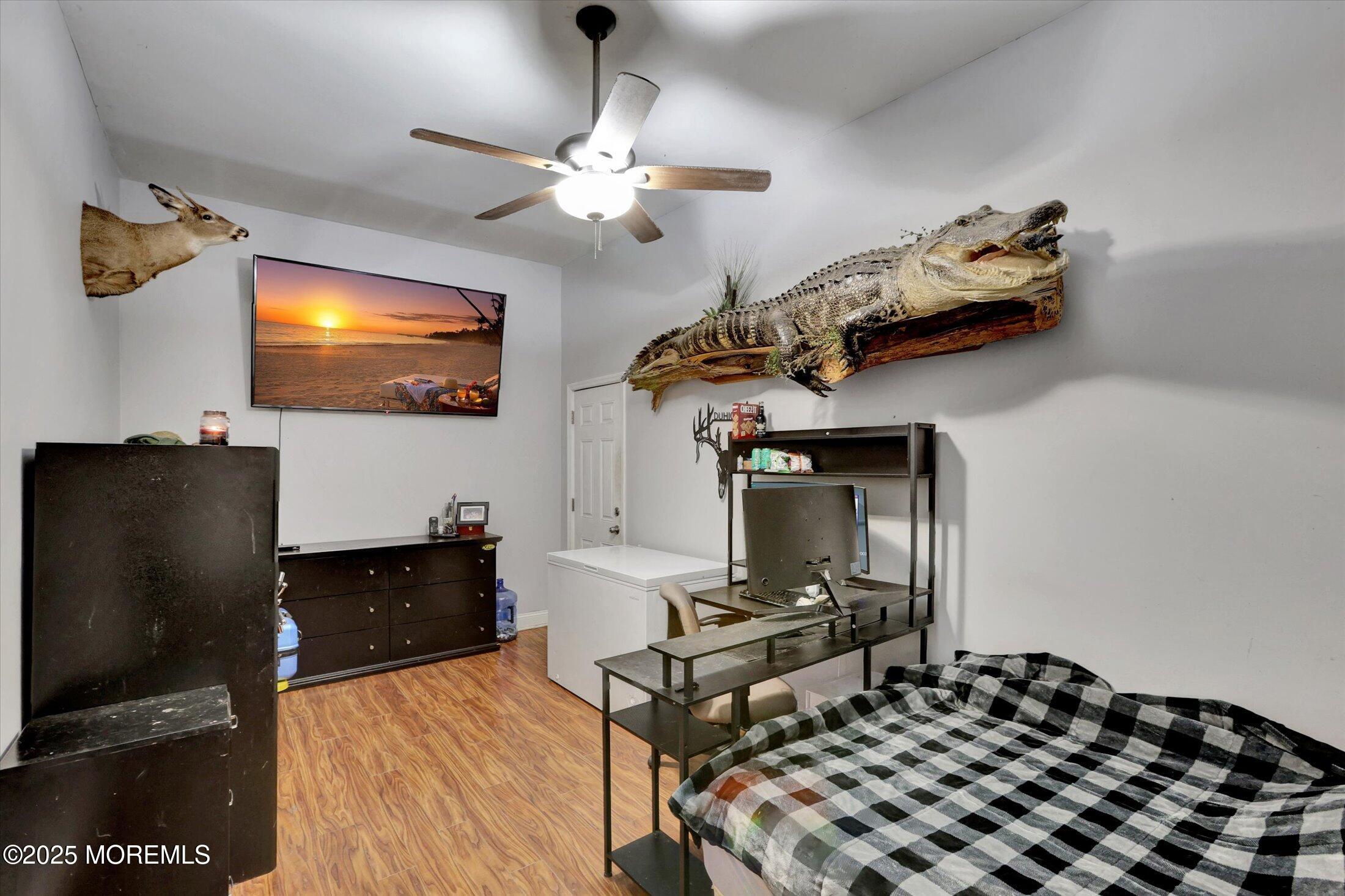 8 Shadow Ridge Court Howell, NJ 07731 - Photo 16 of 39 a living room with furniture and a flat screen tv