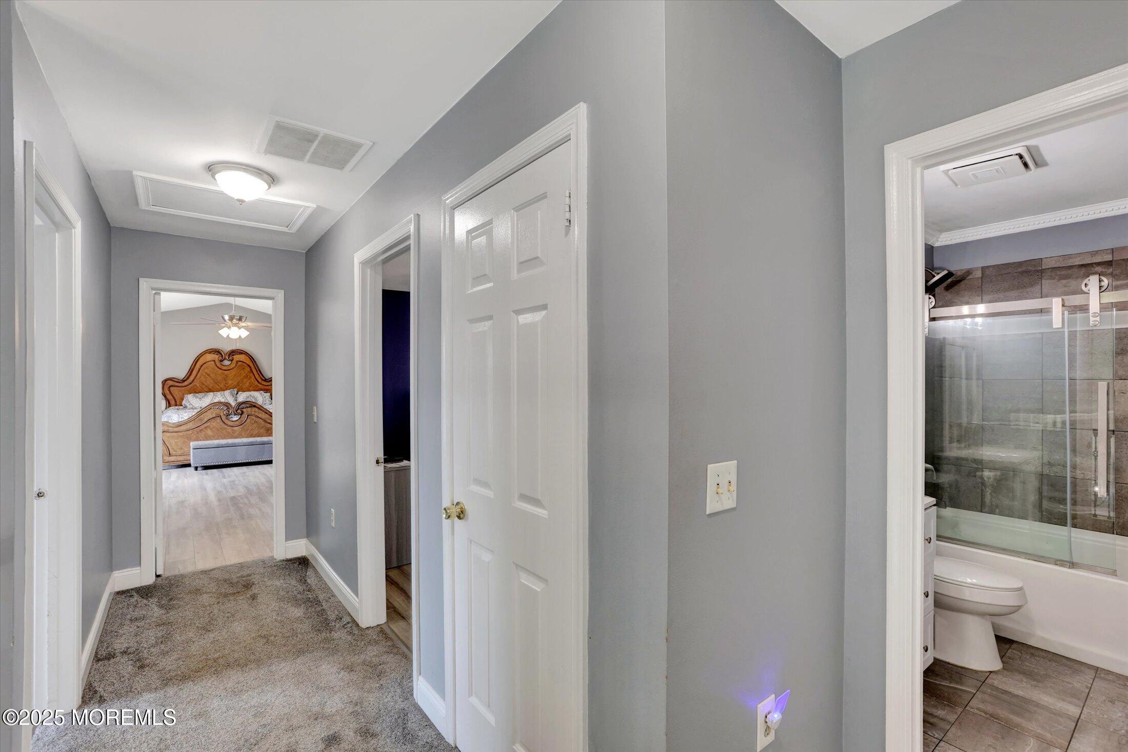 8 Shadow Ridge Court Howell, NJ 07731 - Photo 19 of 39 a view of a bathroom from a hallway