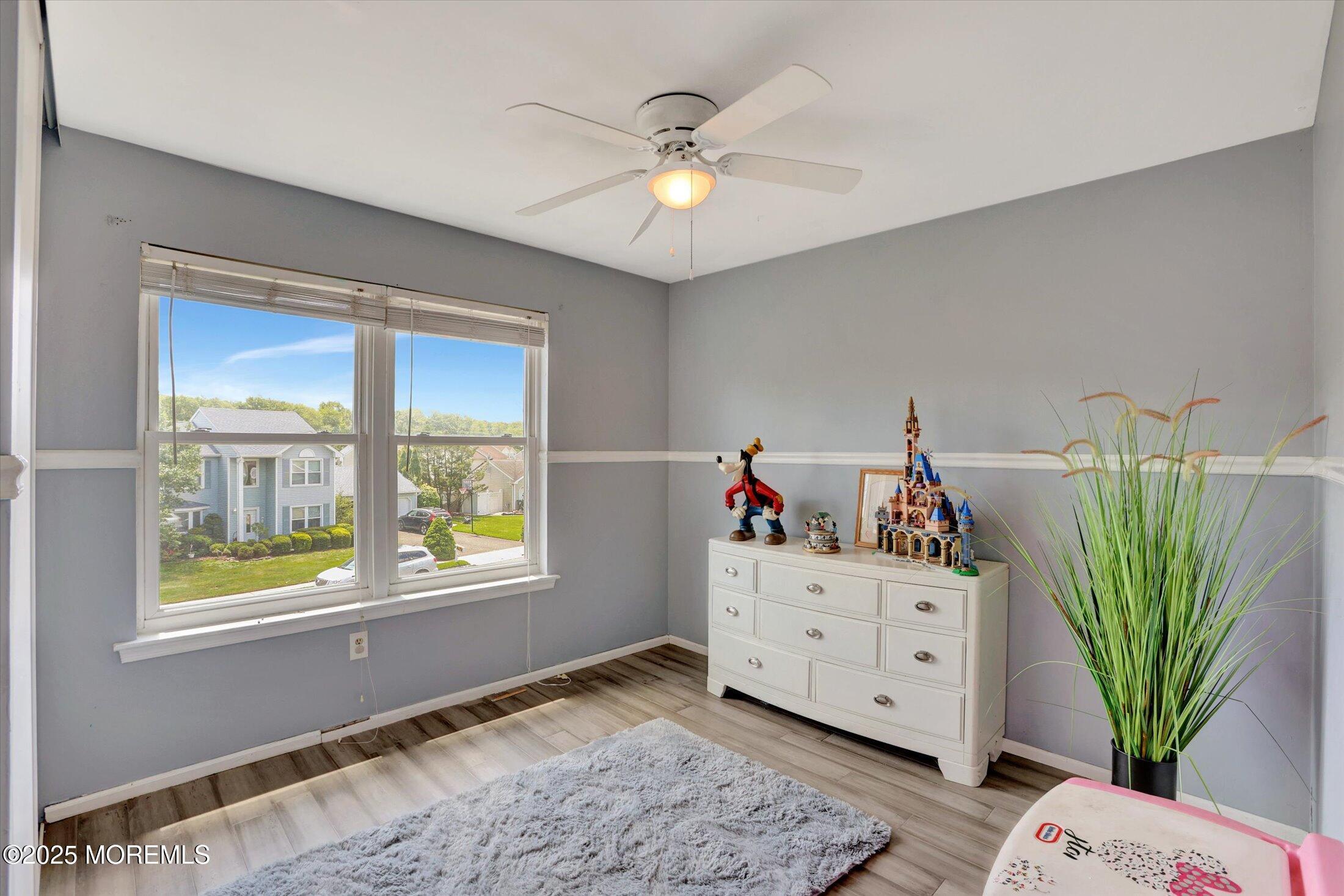 8 Shadow Ridge Court Howell, NJ 07731 - Photo 22 of 39 a view of hallway with window and cabinet