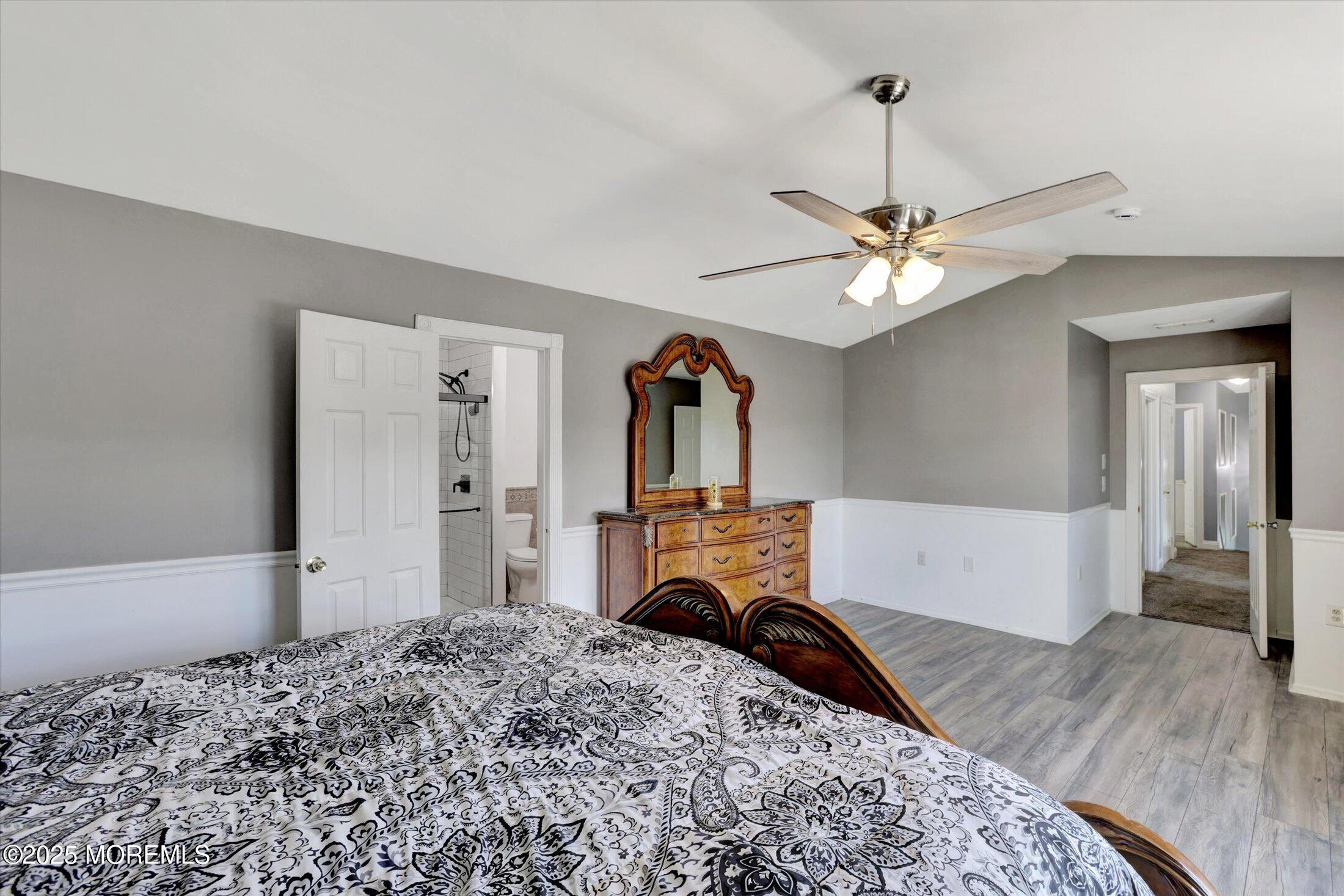8 Shadow Ridge Court Howell, NJ 07731 - Photo 24 of 39 a bedroom with a bed chandelier and a window