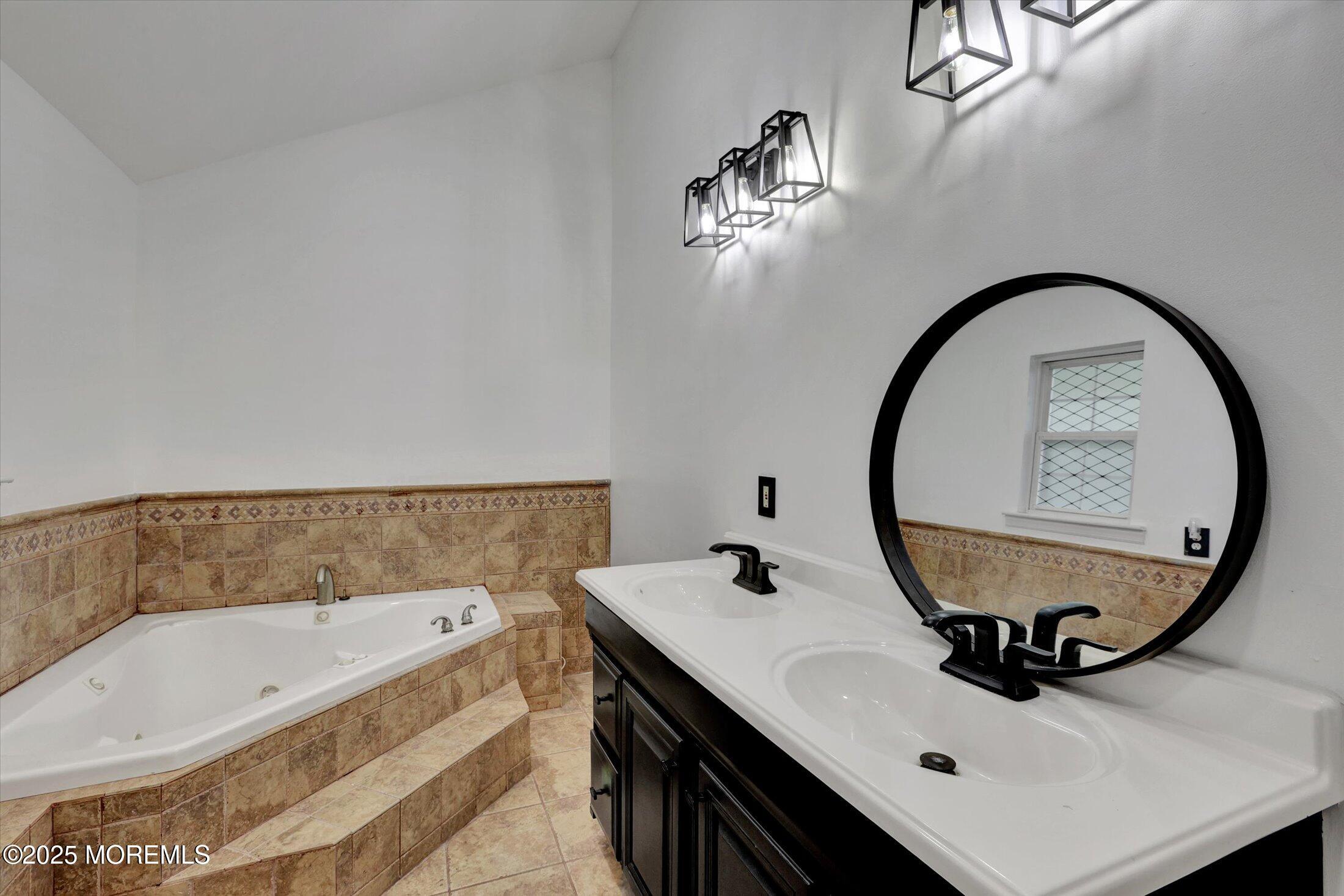 8 Shadow Ridge Court Howell, NJ 07731 - Photo 26 of 39 a bathroom with a sink and a mirror
