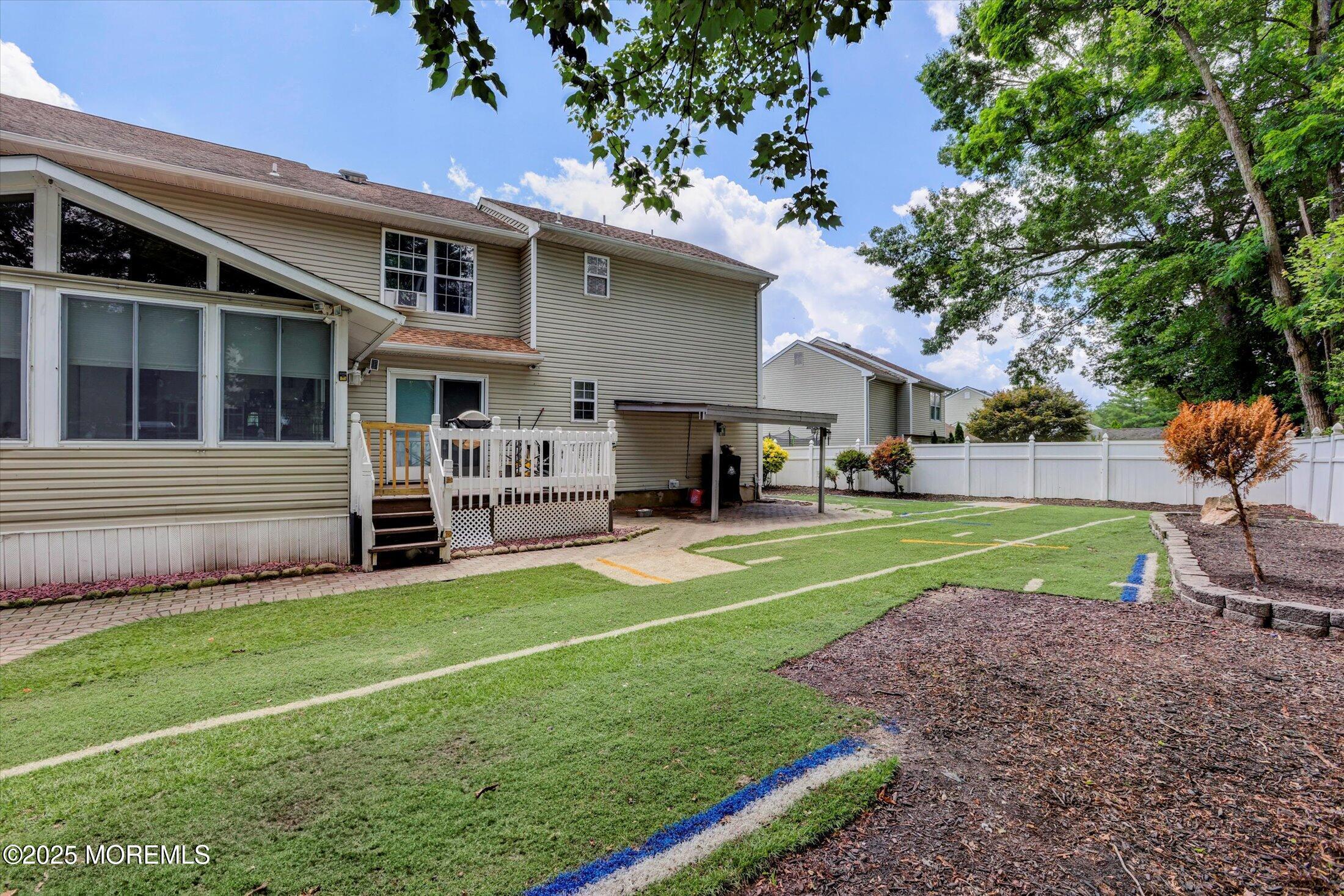 8 Shadow Ridge Court Howell, NJ 07731 - Photo 34 of 39 a view of a house with a back yard