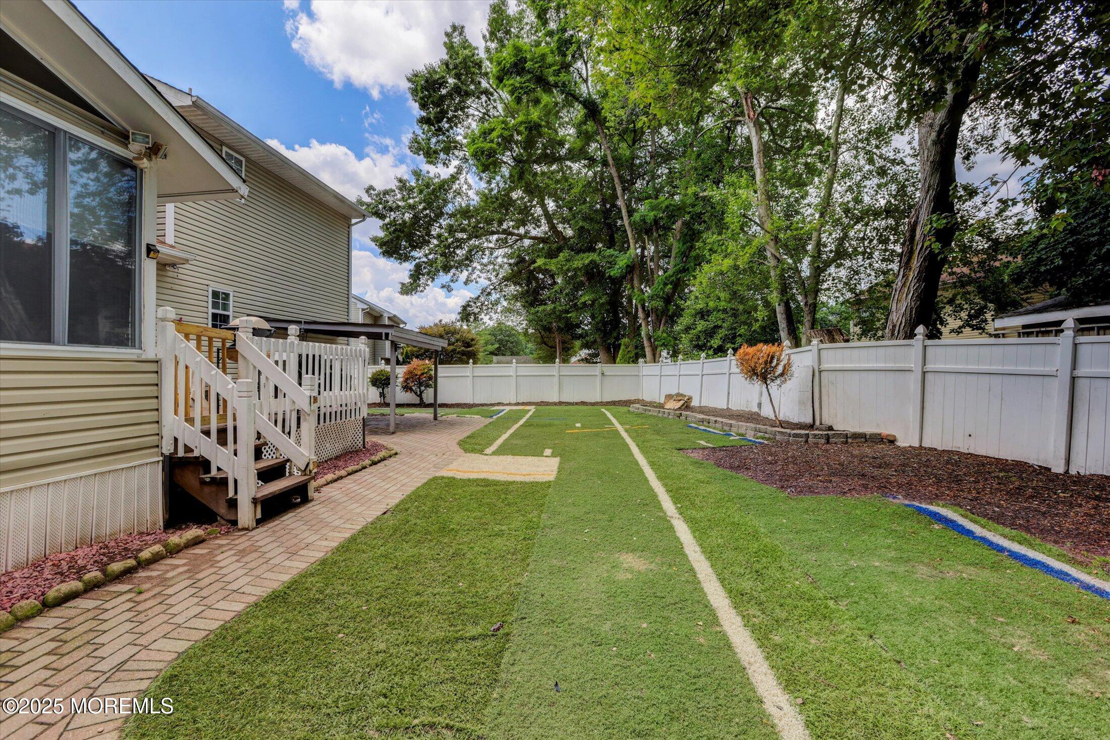 8 Shadow Ridge Court Howell, NJ 07731 - Photo 35 of 39 a view of a backyard with a small cabin