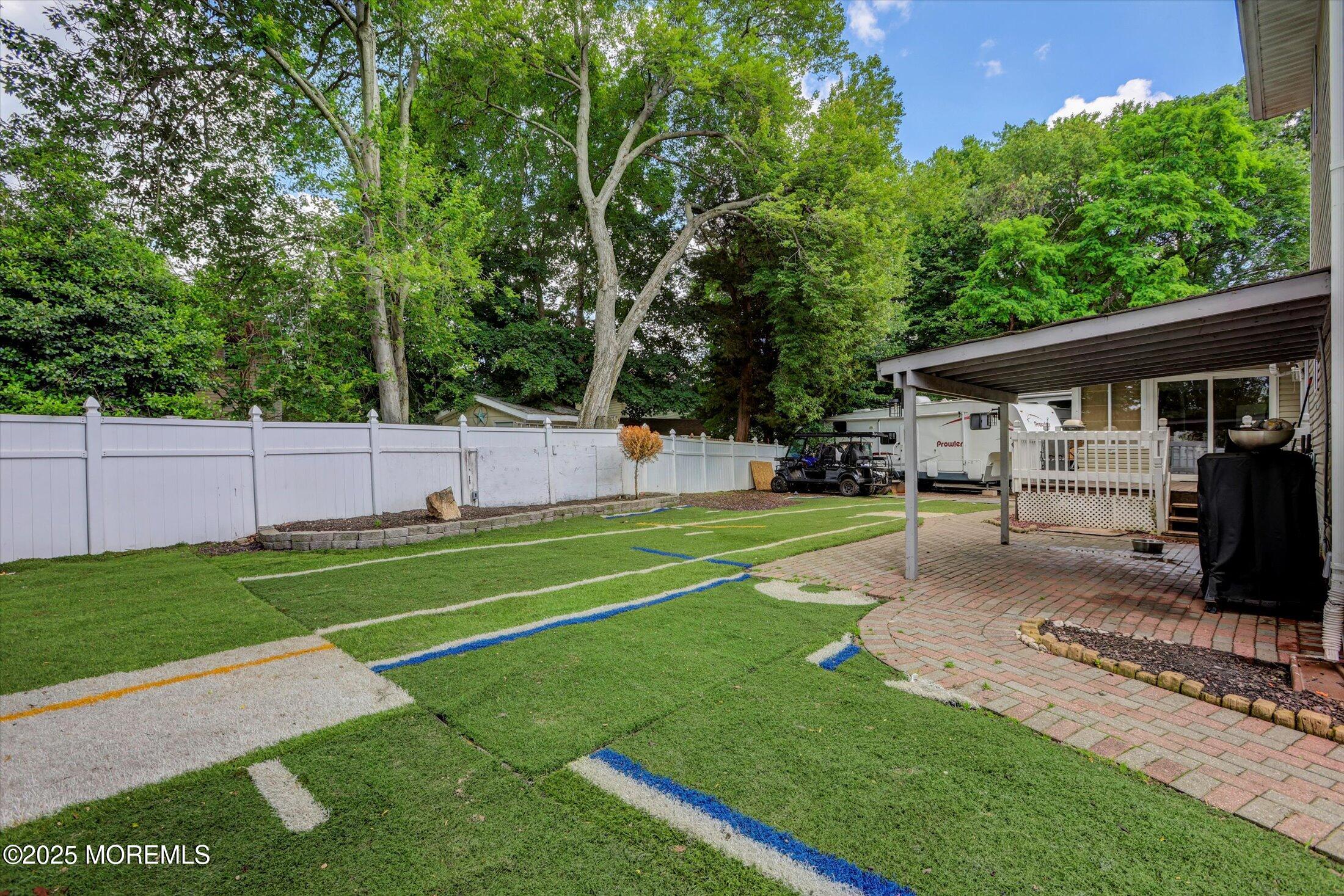 8 Shadow Ridge Court Howell, NJ 07731 - Photo 37 of 39 a view of backyard with house and trees