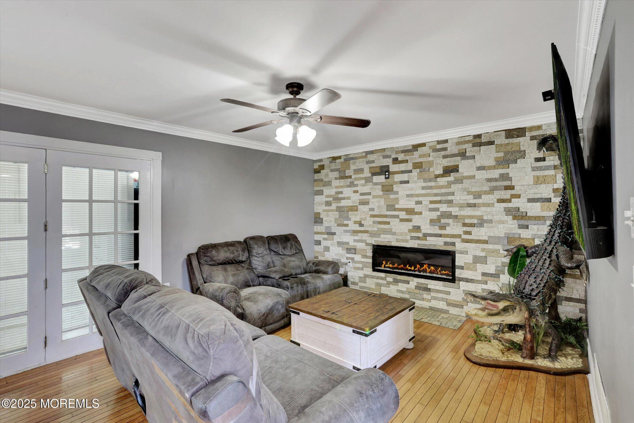 8 Shadow Ridge Court Howell, NJ 07731 - Photo 9 of 39 a living room with furniture and a fireplace