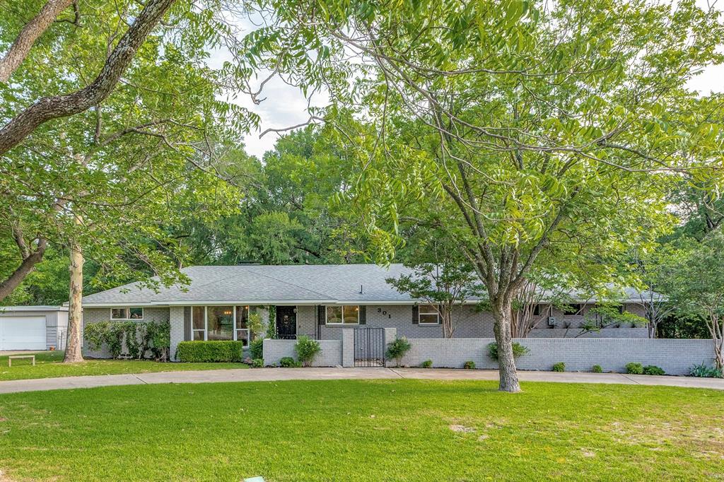 301 Keith Drive Allen, TX 75002 - Photo 1 of 1 a view of a house with a big yard and large trees