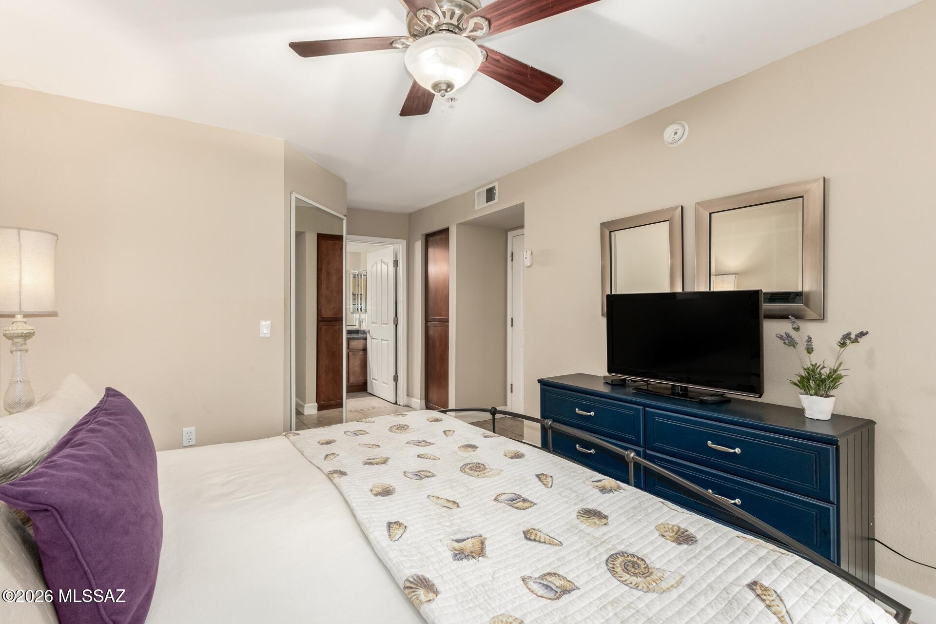 5751 North Kolb Road, Unit 25103 Tucson, AZ 85750 - Photo 8 of 24 Primary bedroom with walk in closet and bath.