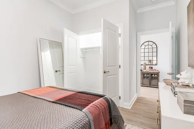 a bedroom with a bed and a dresser