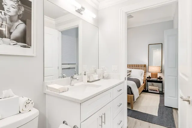 a en suite bathroom with 2 sink and a mirror