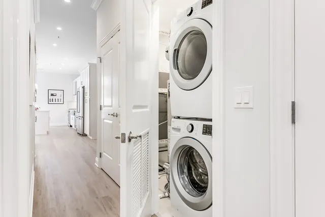 a view of a hallway with washer and dryer