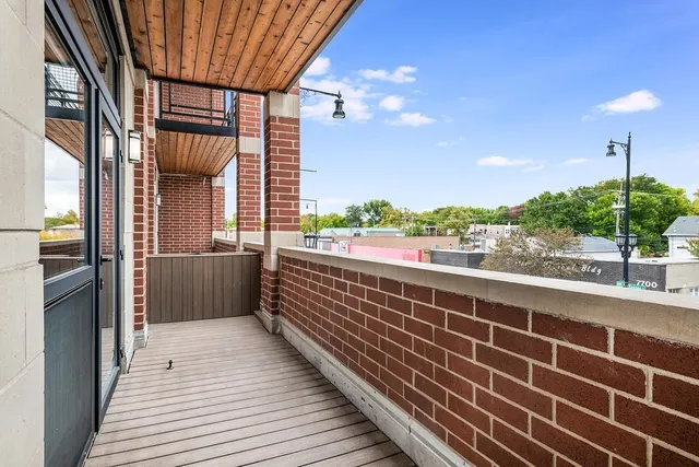 a view of balcony with furniture