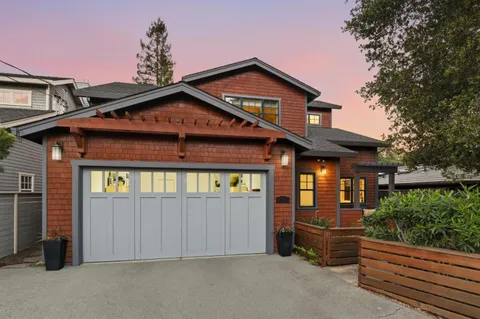 a front view of a house with a garage