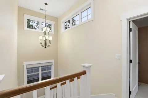 a view of a hallway with windows