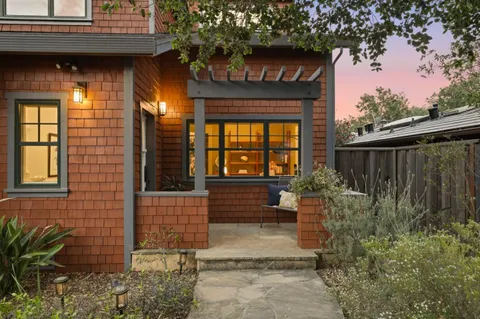 a view of house with backyard and garden
