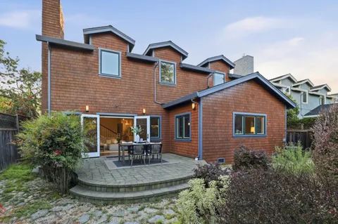 a view of a house with a yard and plants