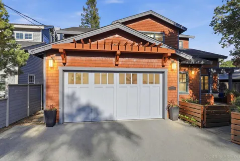 a front view of a house with a garage