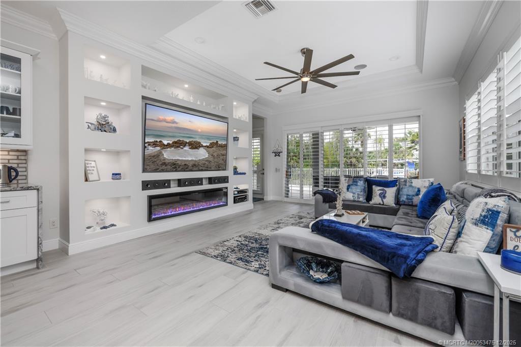 467 Southwest Lost River Road Stuart, FL 34997 - Photo 21 of 65 a living room with furniture and a flat screen tv