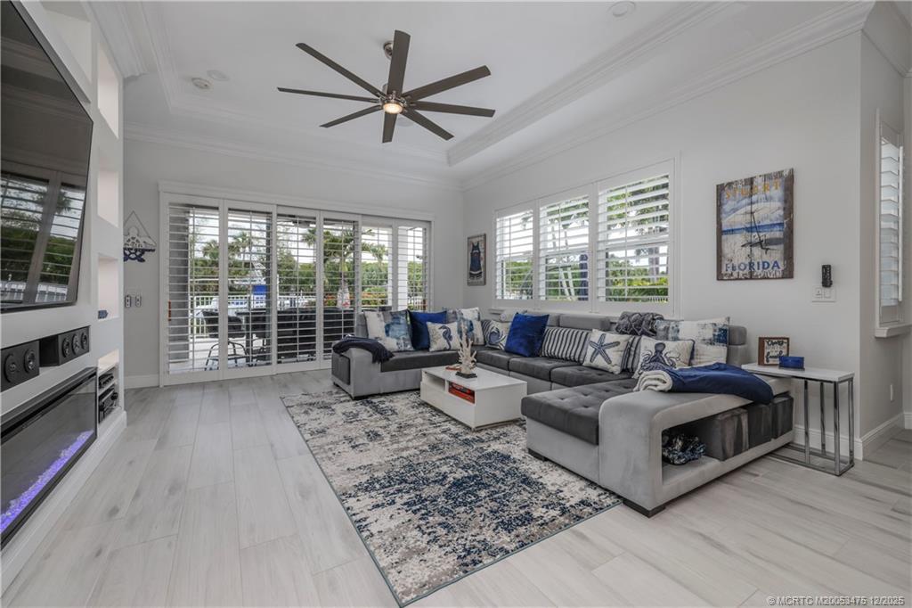467 Southwest Lost River Road Stuart, FL 34997 - Photo 22 of 65 a living room with furniture and a flat screen tv
