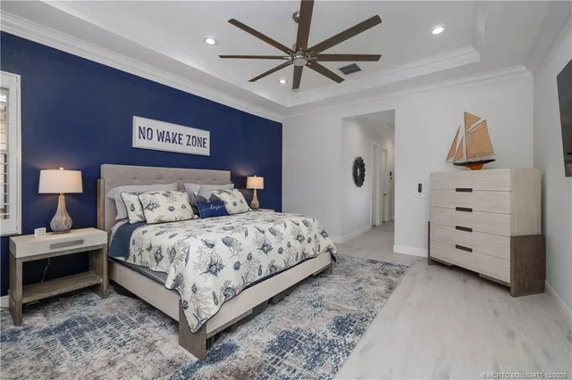 a bedroom with bed and a night stand