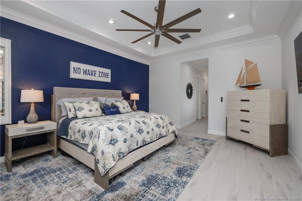 467 Southwest Lost River Road Stuart, FL 34997 - Photo 24 of 65 a bedroom with a bed and a closet