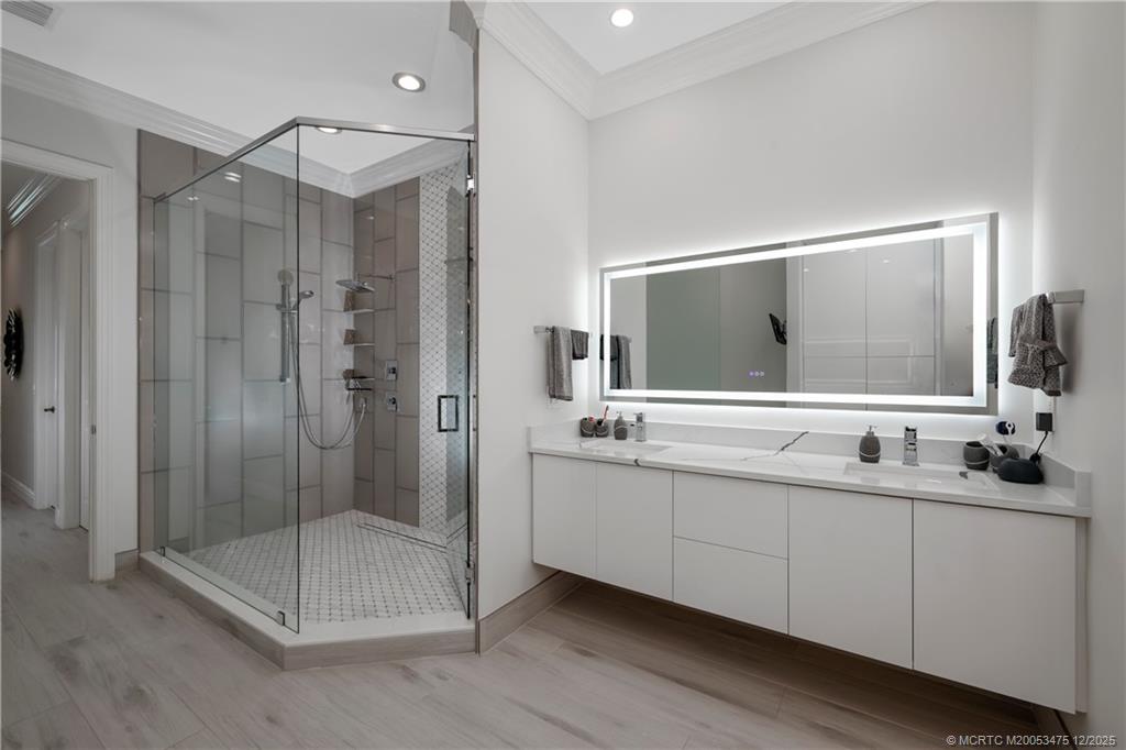 467 Southwest Lost River Road Stuart, FL 34997 - Photo 27 of 65 a bathroom with a double vanity sink mirror and double