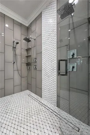 a kitchen with a refrigerator and a stove