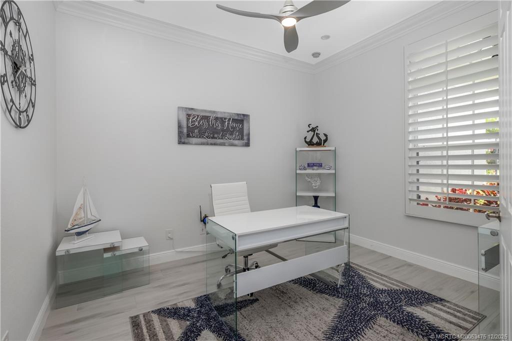 467 Southwest Lost River Road Stuart, FL 34997 - Photo 30 of 65 a bedroom with a bed and a window