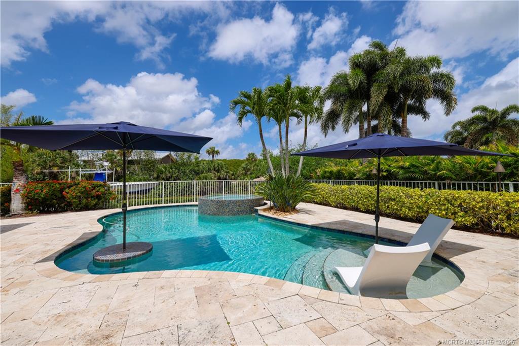 467 Southwest Lost River Road Stuart, FL 34997 - Photo 3 of 65 a view of a garden with a patio