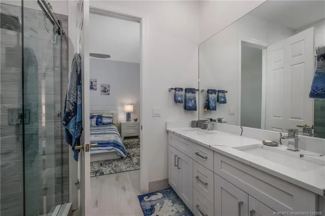 a view of a lake with boats next to a yard