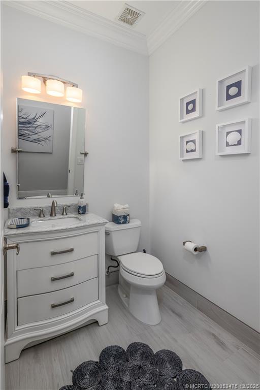 467 Southwest Lost River Road Stuart, FL 34997 - Photo 37 of 65 a bathroom with a toilet sink and mirror