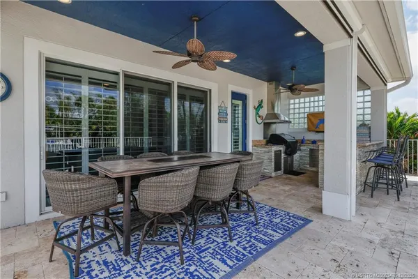 an aerial view of a house with yard swimming pool and outdoor seating