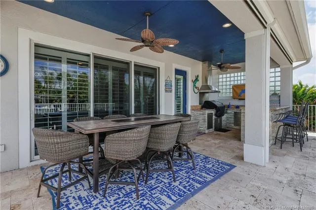an aerial view of a house with yard swimming pool and outdoor seating