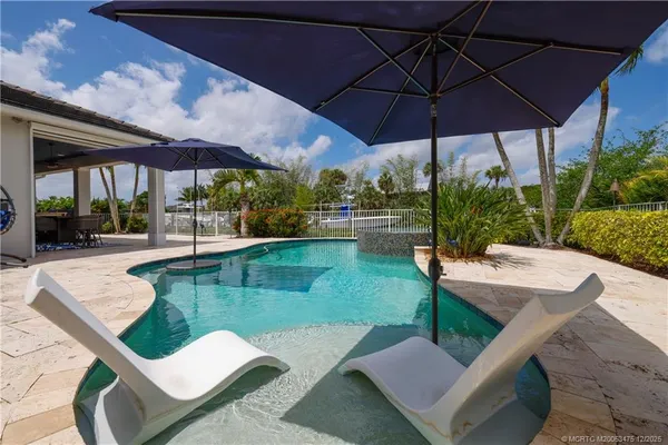 an aerial view of a house with a garden