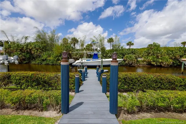 an aerial view of a house with garden space and outdoor seating