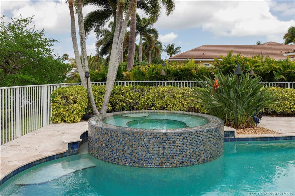 467 Southwest Lost River Road Stuart, FL 34997 - Photo 49 of 65 a view of a large tub with a garden