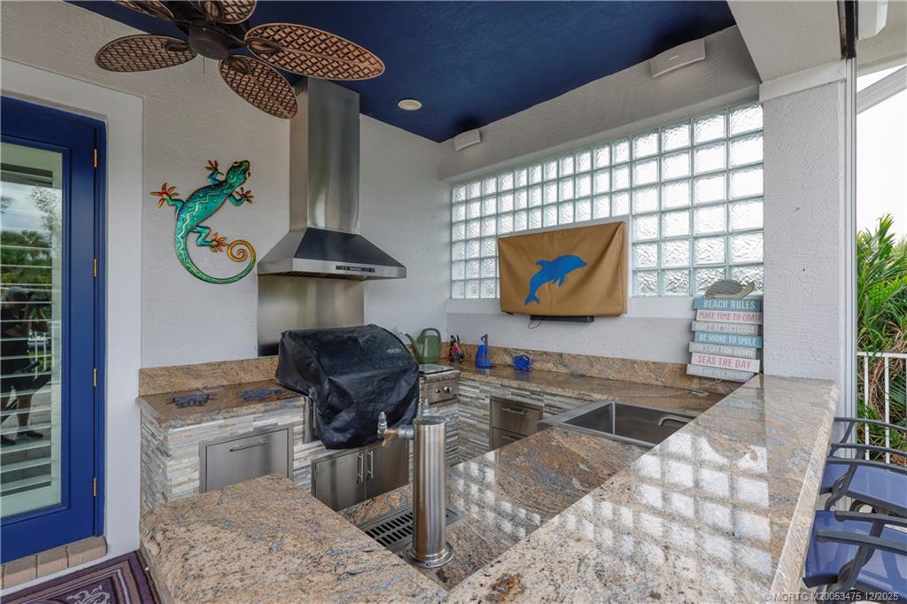 467 Southwest Lost River Road Stuart, FL 34997 - Photo 50 of 65 a living room with furniture and a potted plant