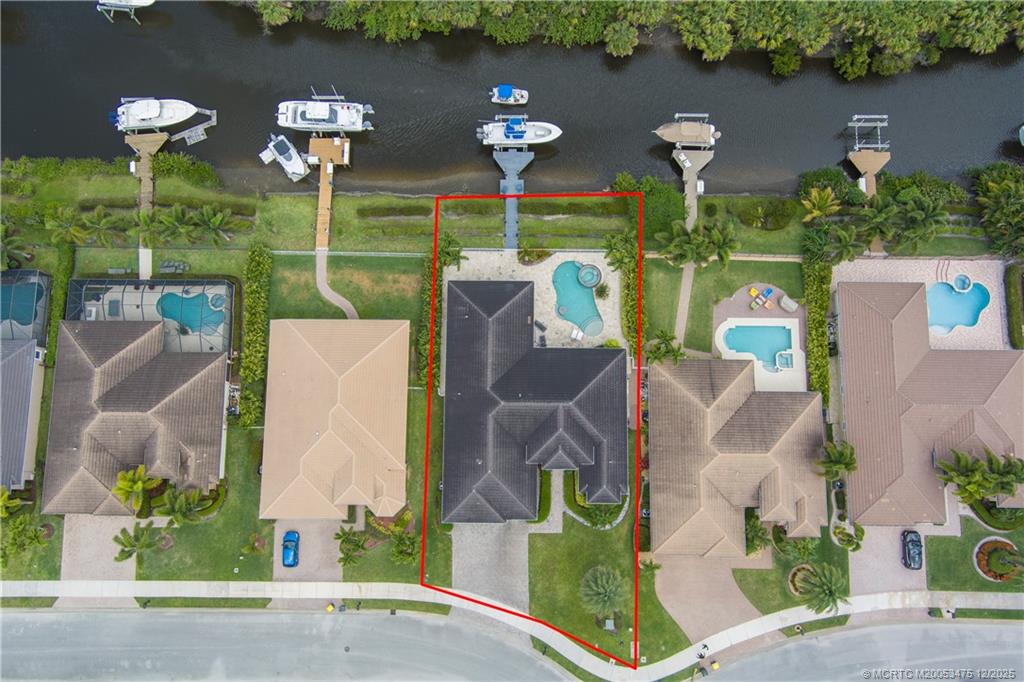 467 Southwest Lost River Road Stuart, FL 34997 - Photo 54 of 65 an aerial view of a house with yard swimming pool and outdoor seating