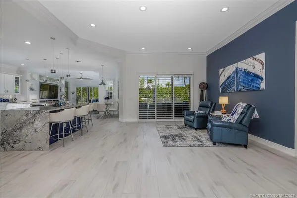 a large kitchen with a table and chairs