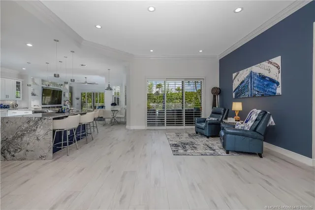 a large kitchen with a table and chairs