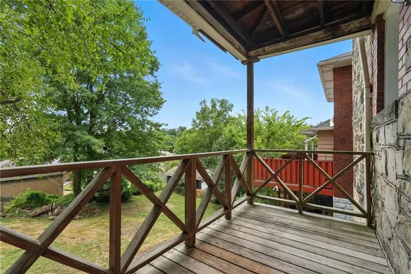 a view of balcony with furniture