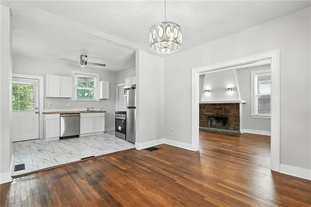 a view of a kitchen with a sink a kitchen and a window