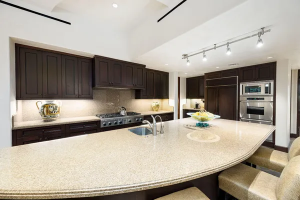 a bedroom with a large bed and a couch