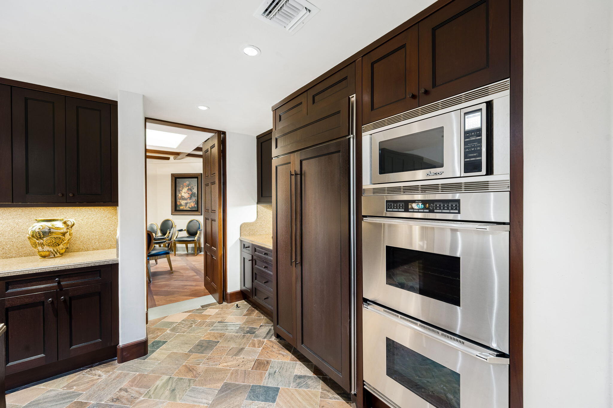 100 Lantana View Palm Desert, CA 92260 - Photo 27 of 121 a kitchen with stainless steel appliances a stove microwave and refrigerator